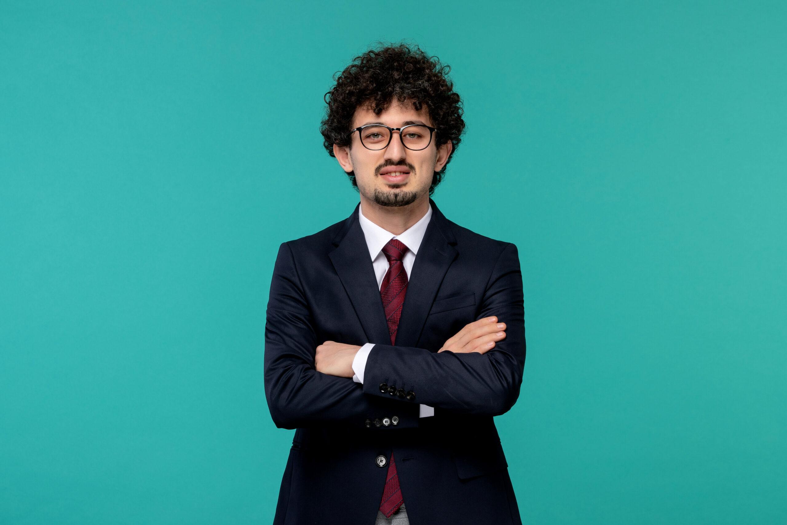 pixabay-business-man-curly-cute-handsome-guy-black-suit-red-tie-glasses-with-crossed-hands